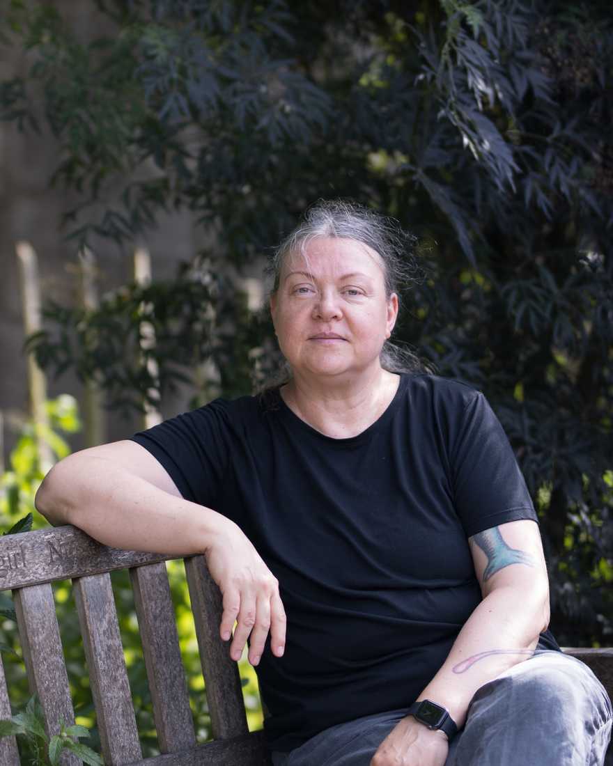 Kat Obring sitting on a garden bench